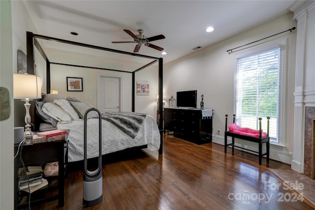 bedroom featuring ceiling fan and dark hardwood / wood-style flooring