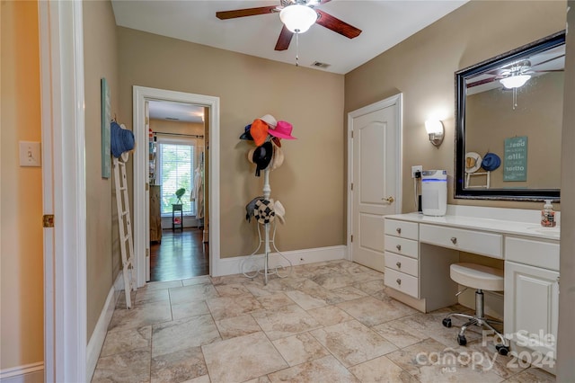 bathroom with ceiling fan and vanity