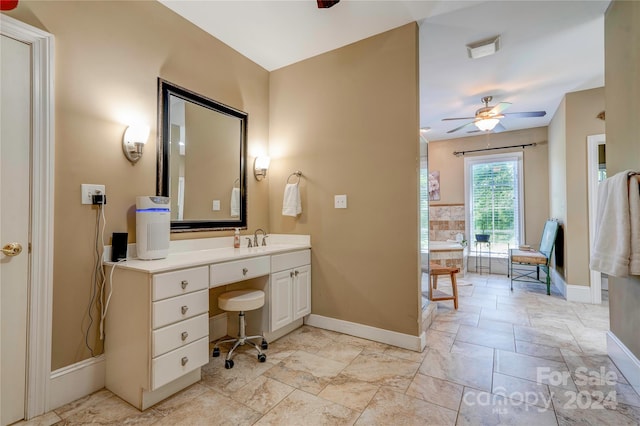 bathroom featuring ceiling fan and vanity