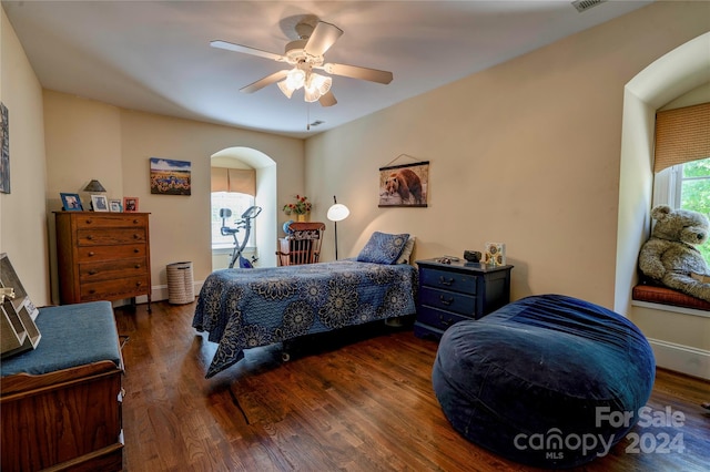 bedroom featuring dark hardwood / wood-style flooring and ceiling fan