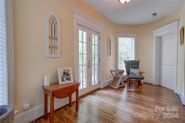 interior space featuring hardwood / wood-style floors and french doors