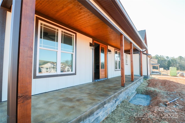 view of property exterior featuring covered porch