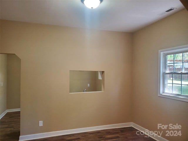 empty room featuring dark hardwood / wood-style floors