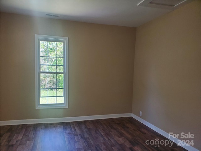 empty room featuring dark hardwood / wood-style floors