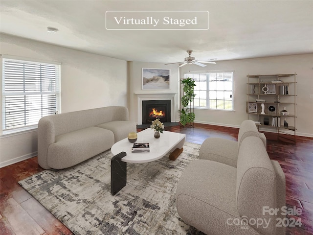 living room featuring ceiling fan and wood-type flooring