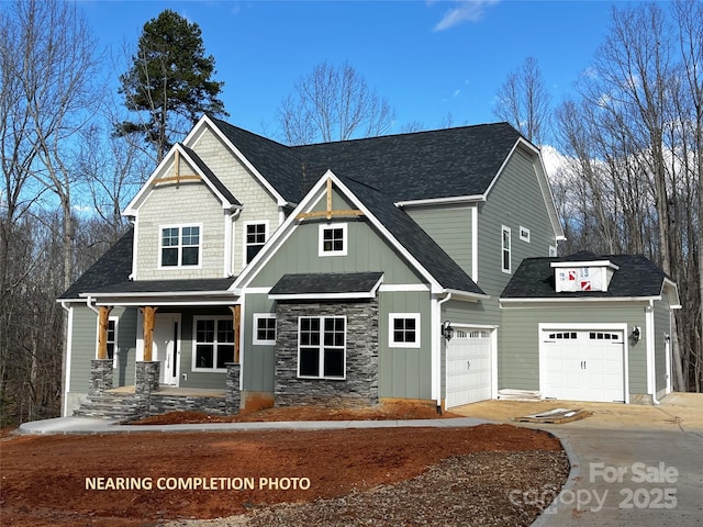 craftsman-style house featuring covered porch and a garage