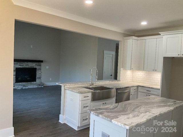 kitchen with white cabinets, dark hardwood / wood-style floors, sink, and dishwasher