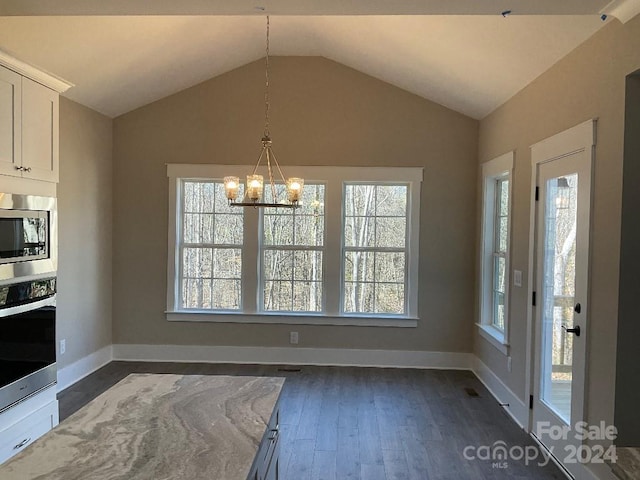 kitchen with light stone counters, stainless steel appliances, dark hardwood / wood-style flooring, vaulted ceiling, and white cabinets