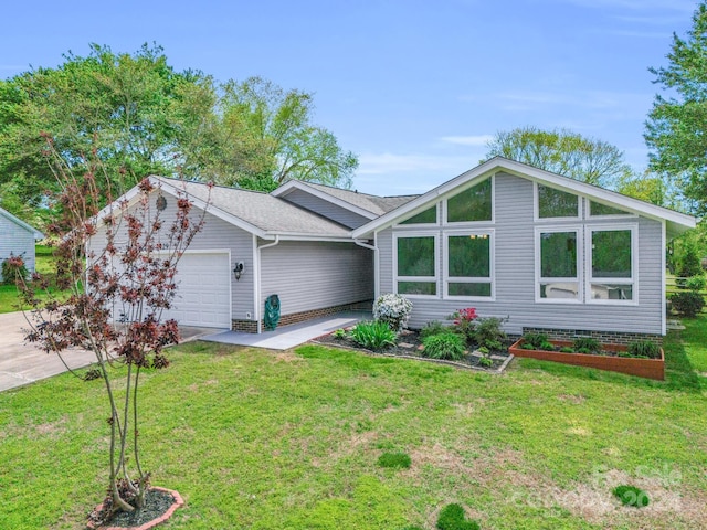 single story home featuring a front yard and a garage