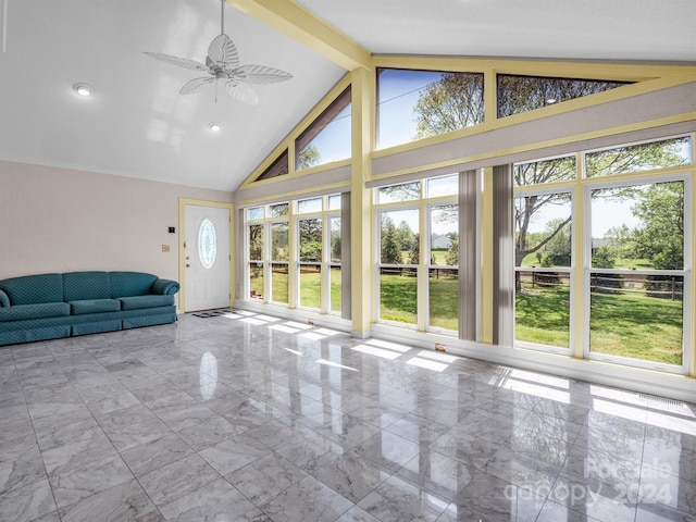 unfurnished sunroom featuring lofted ceiling with beams and ceiling fan