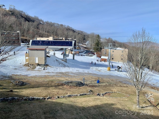 yard covered in snow with an outdoor structure