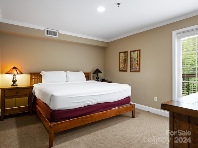 bedroom featuring ornamental molding and dark carpet