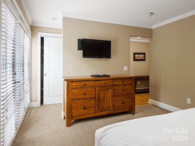 carpeted bedroom with crown molding