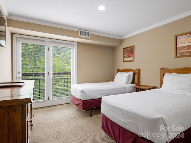 bedroom featuring light colored carpet, ornamental molding, and access to exterior