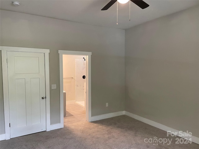 carpeted empty room with ceiling fan