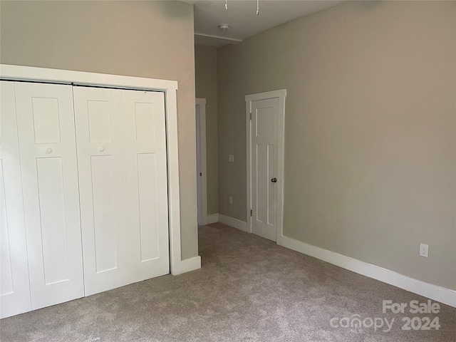 unfurnished bedroom with carpet floors