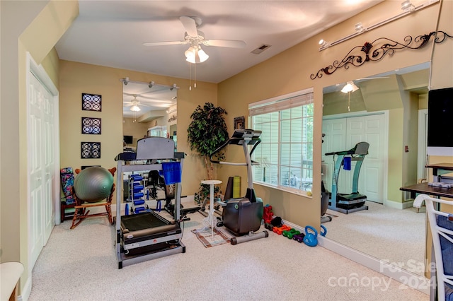 workout area featuring carpet and ceiling fan