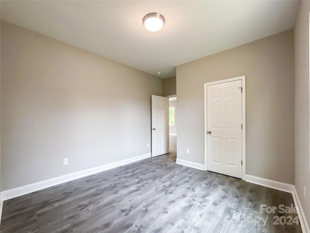 empty room featuring wood-type flooring