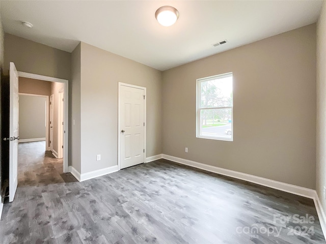 unfurnished bedroom featuring hardwood / wood-style flooring