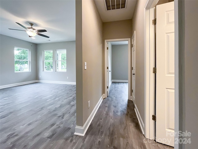 hall with dark hardwood / wood-style flooring