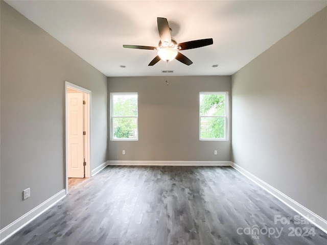 unfurnished room featuring ceiling fan and hardwood / wood-style flooring