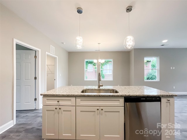 kitchen featuring dishwasher, white cabinets, sink, and decorative light fixtures