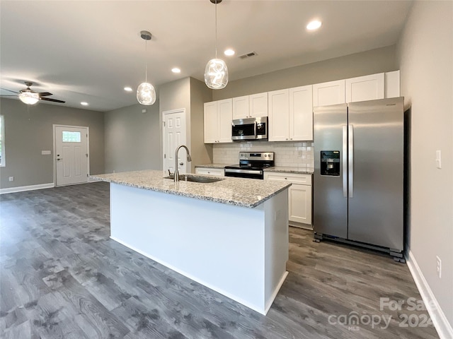 kitchen with white cabinets, dark hardwood / wood-style flooring, sink, and stainless steel appliances