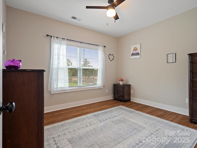 bedroom with ceiling fan and hardwood / wood-style floors