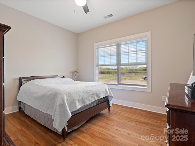 bedroom featuring light wood-type flooring and ceiling fan