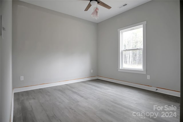 spare room with ceiling fan and hardwood / wood-style floors