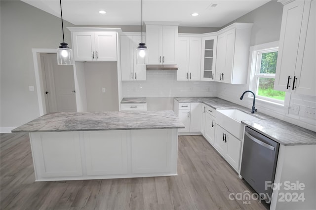 kitchen with white cabinetry, a center island, dishwasher, and hanging light fixtures