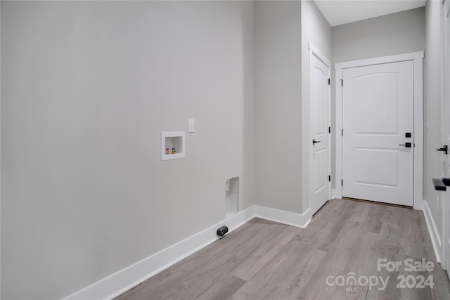 laundry area with washer hookup and light wood-type flooring