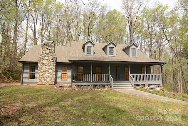 view of front of home with a front lawn and covered porch