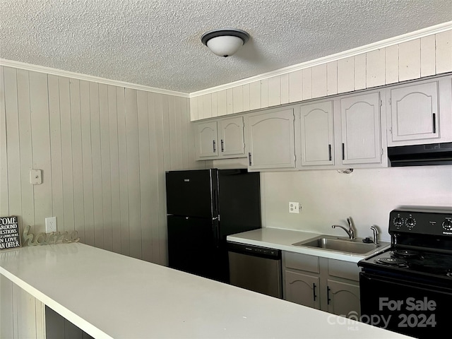 kitchen featuring gray cabinets, black appliances, wooden walls, sink, and ornamental molding