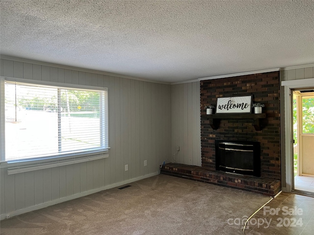 unfurnished living room with light carpet, plenty of natural light, and a fireplace