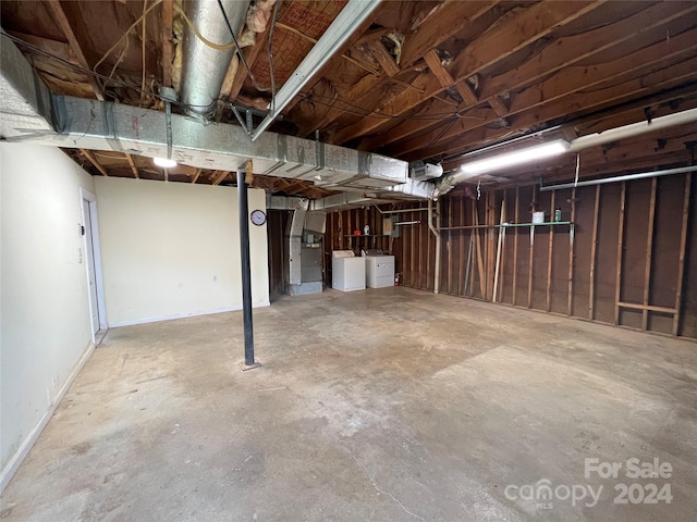 basement with washing machine and clothes dryer