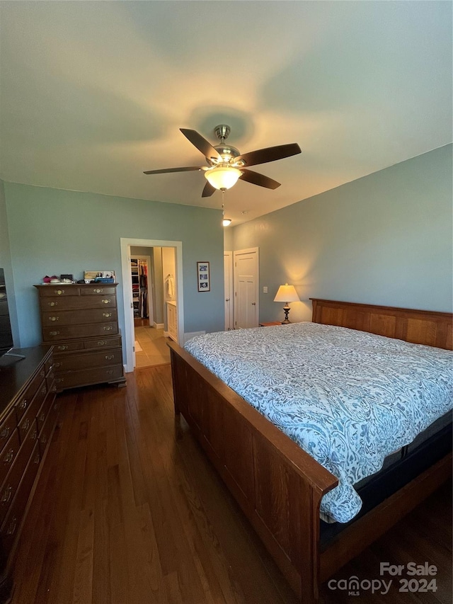 bedroom with a closet, ceiling fan, and dark wood-type flooring