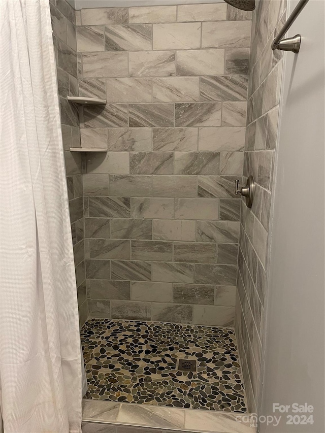 bathroom with a shower with curtain