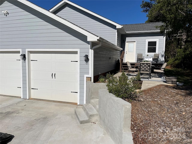 view of property exterior featuring a garage