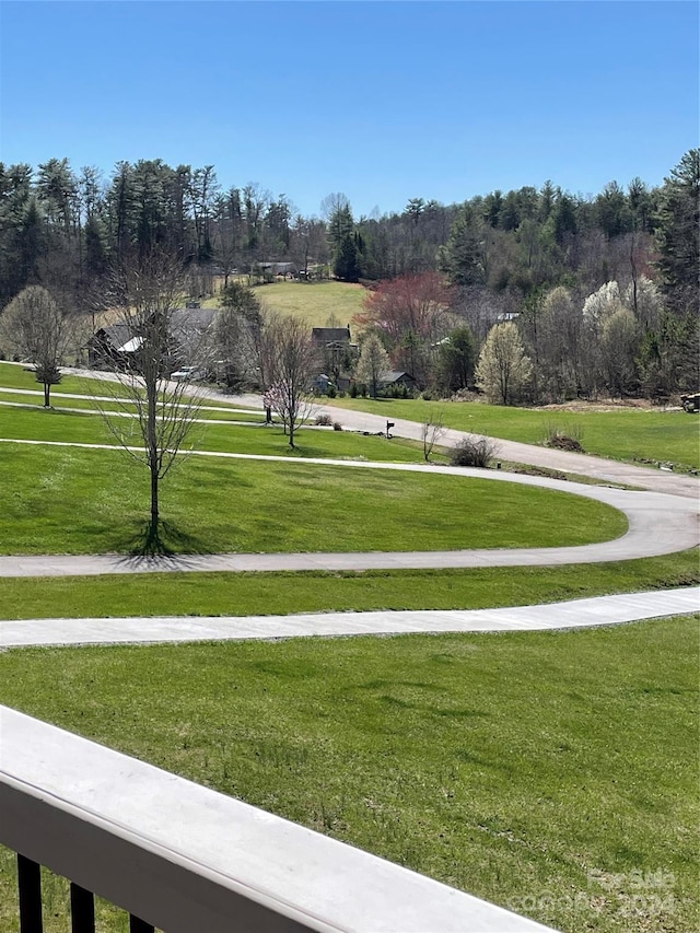 view of property's community with a lawn