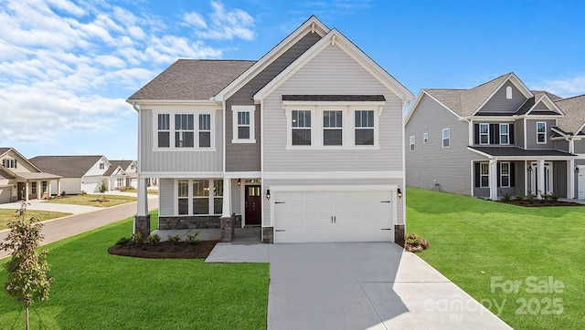 craftsman-style house featuring a garage and a front lawn