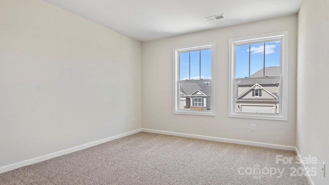 empty room featuring carpet flooring