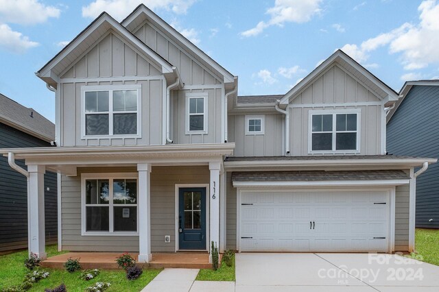 craftsman-style home with a garage and a porch