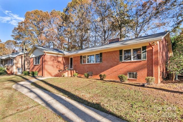 single story home featuring a front lawn