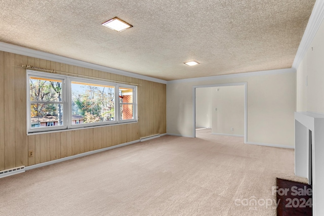 interior space featuring wood walls, light carpet, crown molding, a textured ceiling, and a baseboard radiator