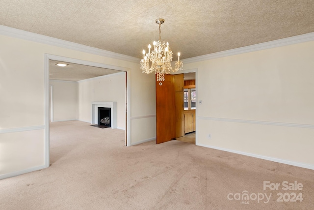 unfurnished room with a notable chandelier, light colored carpet, ornamental molding, and a textured ceiling