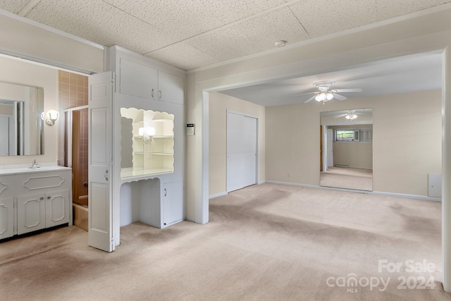 interior space with ceiling fan and vanity