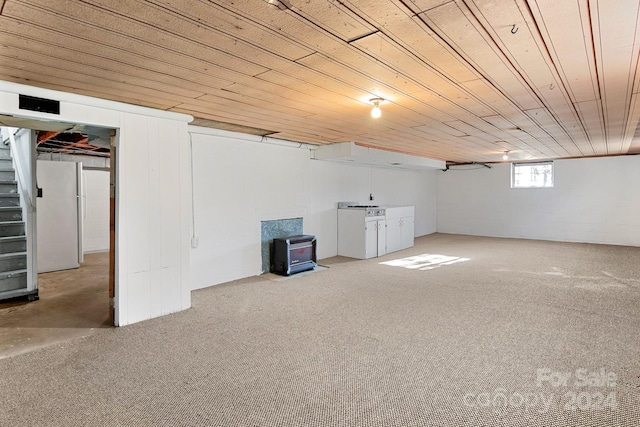 basement featuring carpet flooring and wood ceiling