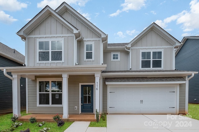 craftsman house with covered porch and a garage