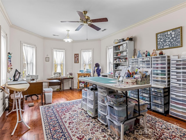 office with ceiling fan, crown molding, and wood-type flooring